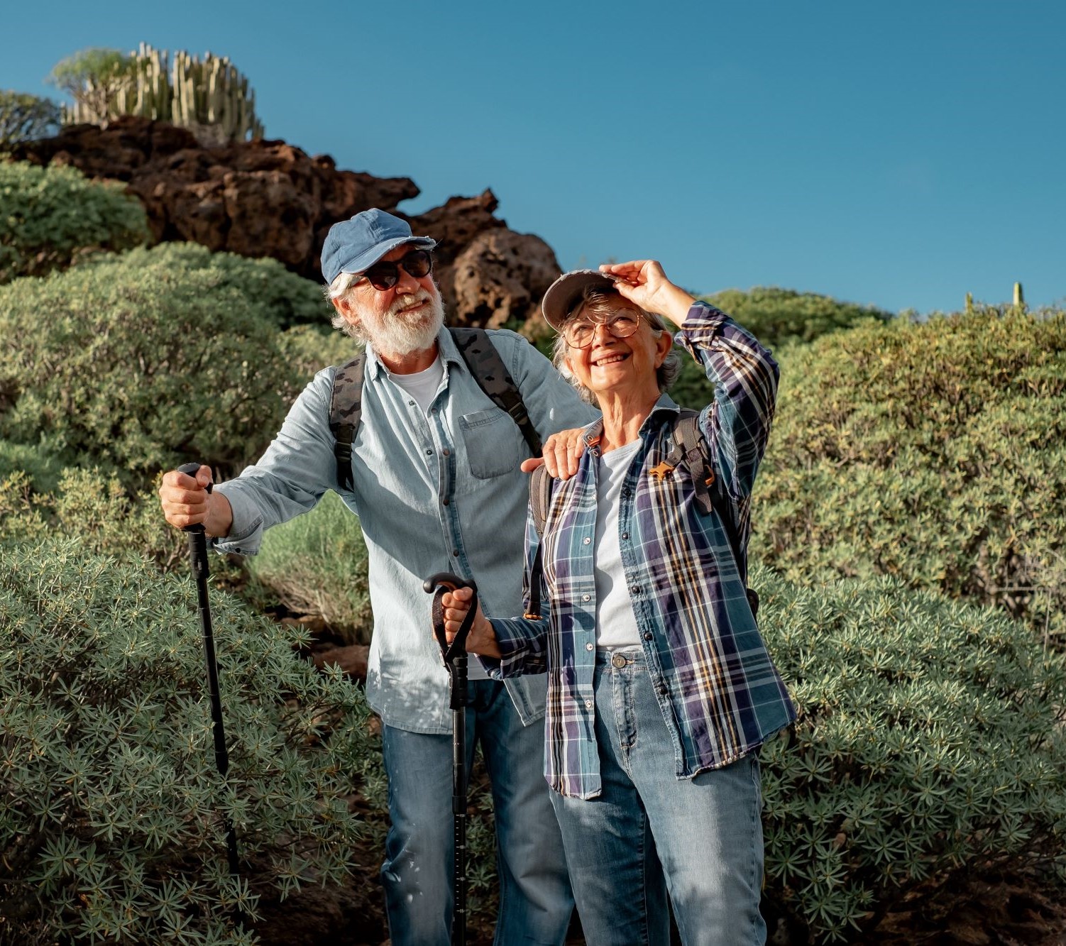 An older couple enjoys a hike together.